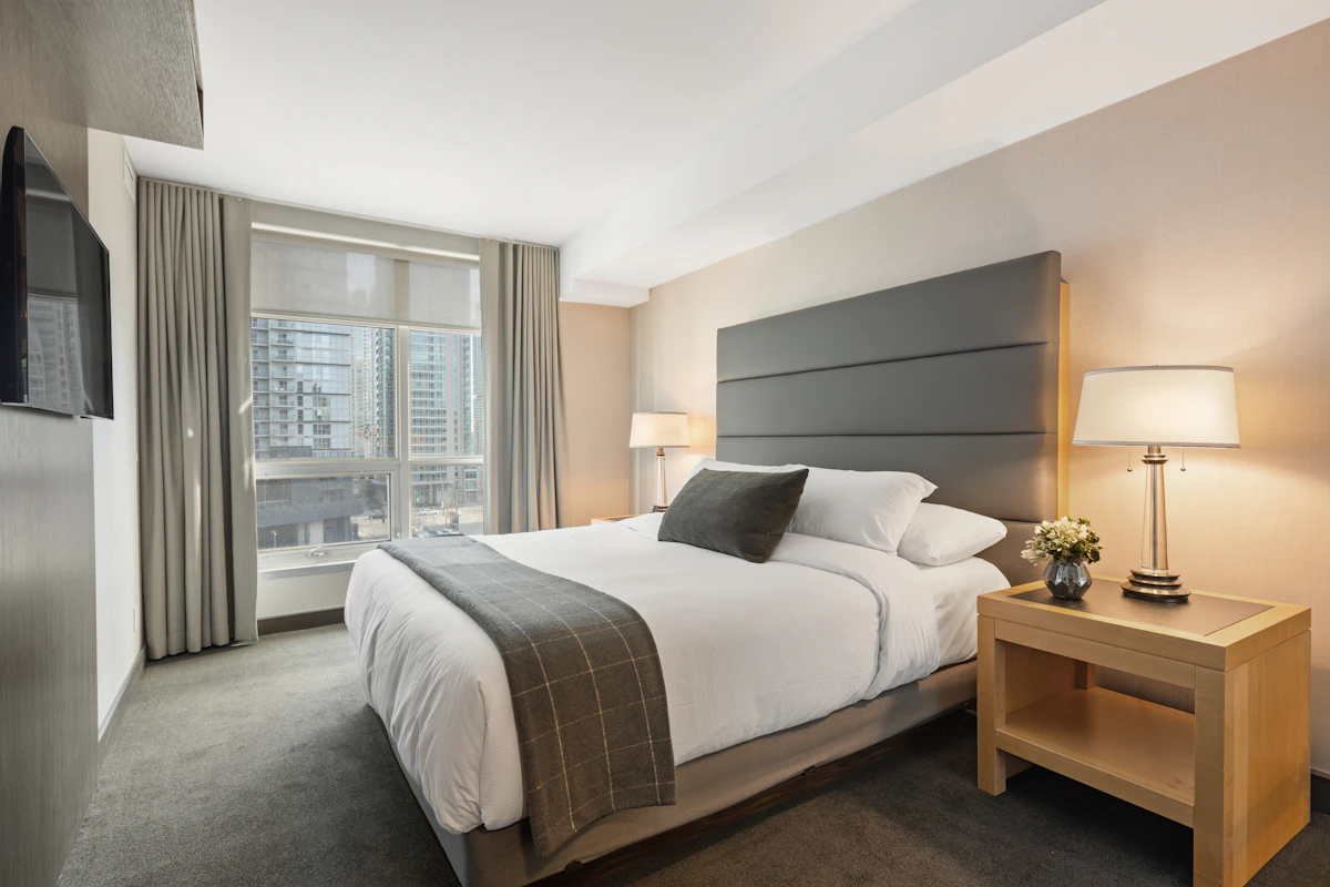 Peaceful bedroom with warm lighting and comfortable bedding